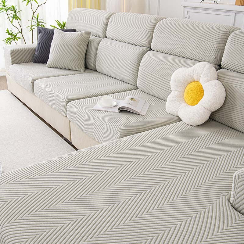 Vollständig umwickelter Couchbezug mit Fischgrätenmuster